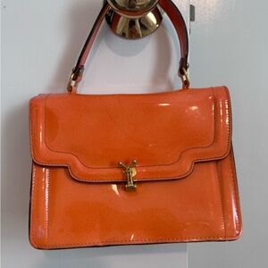 Vintage Orange Patent Leather Handbag with Intricate Clasp